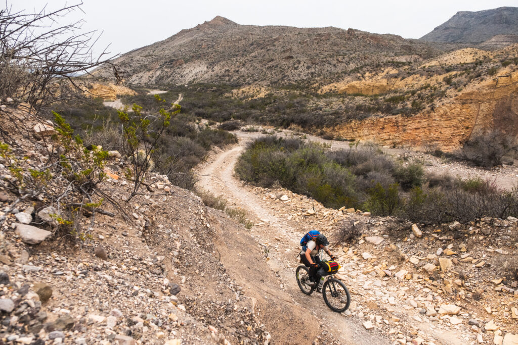 Bikepackers against the Big Bend border wall